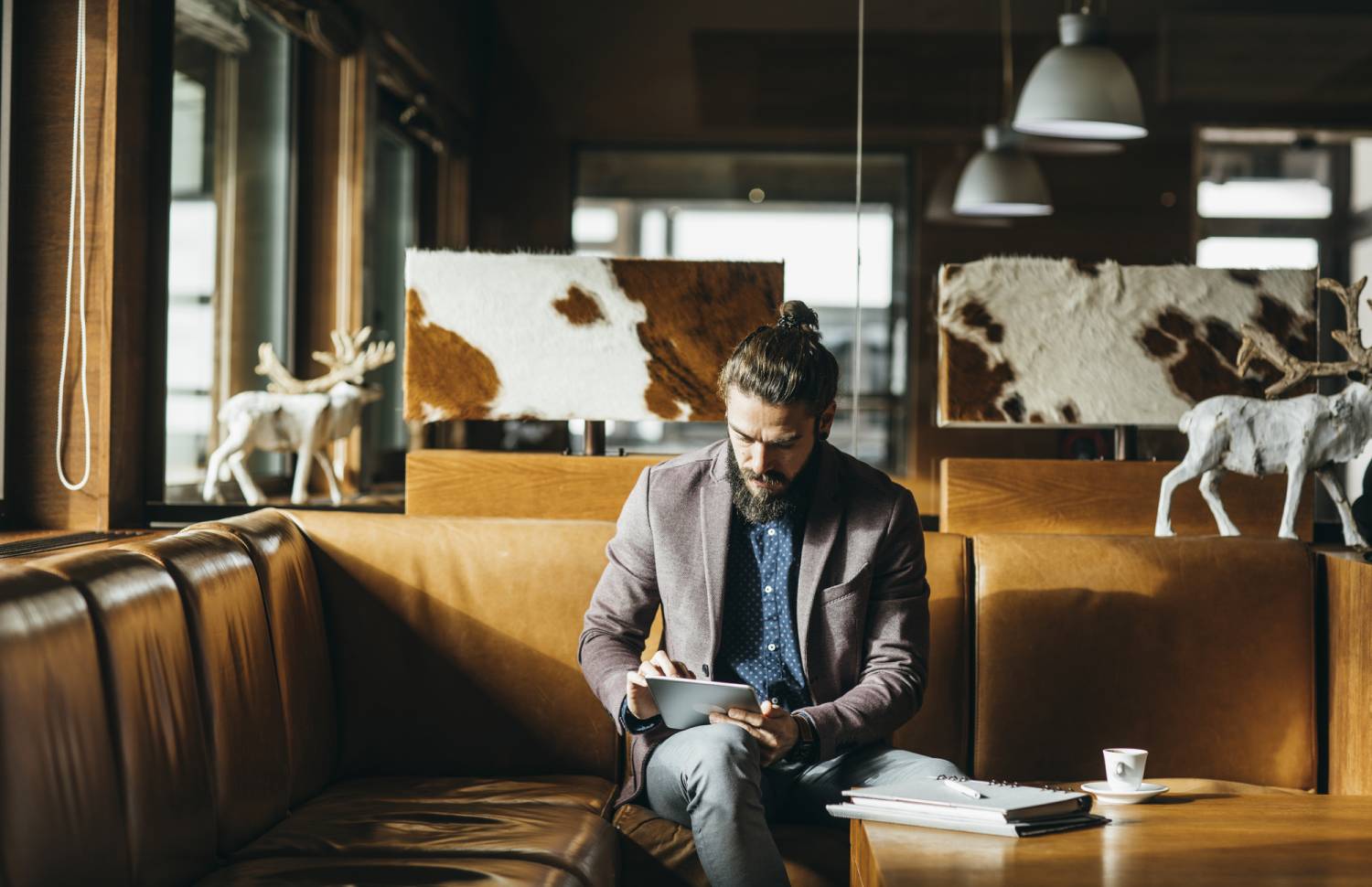 Businessman Sitting at Mountain Hotel and